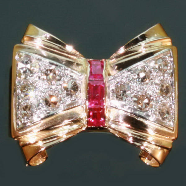 Typical bi-color gold Retro bow ring set with diamonds and rubies